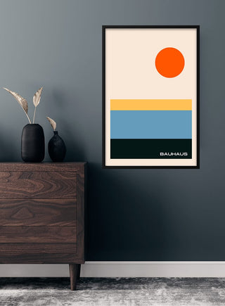 Framed Bauhaus rektangel kunst poster with geometric shapes and a red circle, hanging on a dark wall above a dresser.