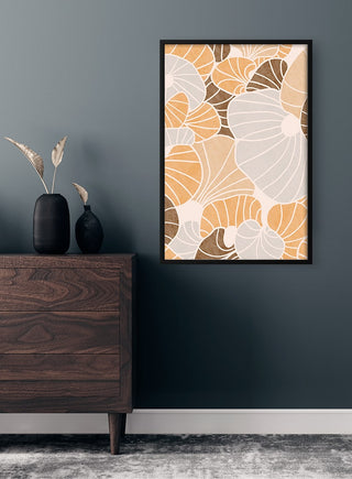 Framed Brown Shells poster with abstract shell patterns in beige, brown, and white tones hanging on a dark wall.