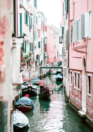 Gondolas on a narrow canal alongside colorful Venetian buildings, featured in the Boat in Venice Plakat.