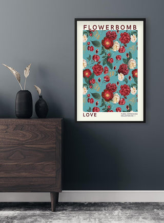 Framed "Flowerbomb - Love" poster with vibrant red and white flowers on a blue background, hanging above a dresser.