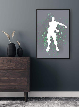 Poster of a Fortnite dance silhouette with green splashes, displayed above a modern wooden dresser.