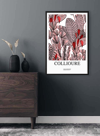 Framed Flowers at Collioure Plakat featuring abstract red and pink botanical design on a dark wall above a dresser.