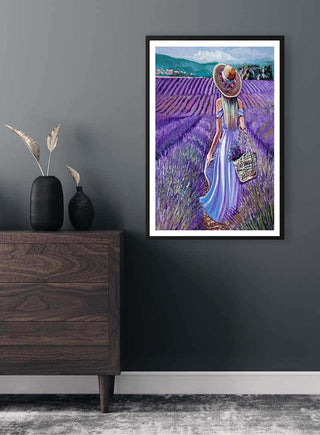 Framed Violet Fields Mademoiselle Plakat on a gray wall above a wooden dresser with minimalist decor.