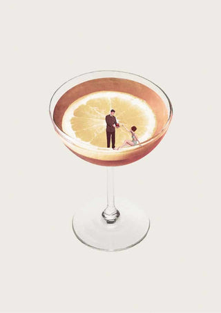 A cocktail glass with a lemon slice inside, featuring two tiny figures standing on the lemon.