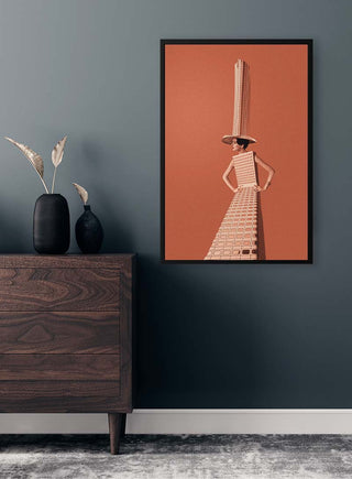 Framed artwork "City girl" by Maarten Léon on a modern interior wall above a dark wooden dresser.