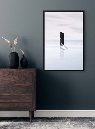 Framed Escapism by Maarten Léon on a dark wall above a dresser with vases and dried plants.