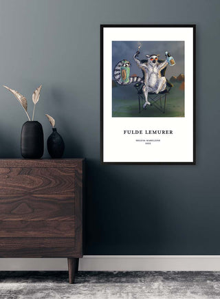 Framed Fulde Lemurer No. 01 - Helena Madeleine art print displayed on a dark wall above a wooden dresser.