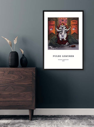 Framed Fulde Lemurer No. 05 - Helena Madeleine art print hanging on a dark wall above a wooden drawer.