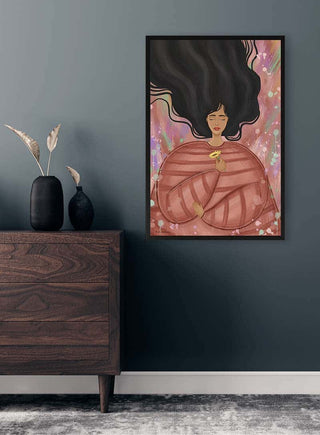 Framed "Mind my Body" art by Kate Aitana displayed above a wooden dresser in a modern room.