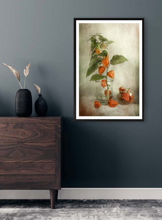 Framed Lanterns by Mandy Disher artwork featuring orange lantern flowers, displayed above a dark wood dresser.