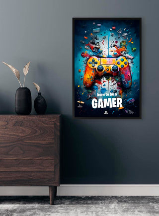 Poster with a colorful game controller and "born to be a GAMER" text, displayed on a modern wall.