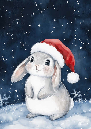 Cute gray bunny wearing a Santa hat sits in the snow with snowflakes falling, perfect for Home for the Holidays.
