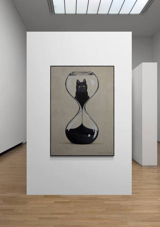 Art print of a black cat inside an hourglass, displayed in a modern gallery; Hourglas Cat by Coco de Paris.