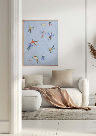 Framed "Snow Angels" by Bea Muller above a white sofa in a modern living room setting.
