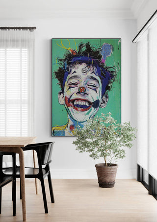 Colorful portrait of a laughing clown on a green background, displayed in a modern dining room.
