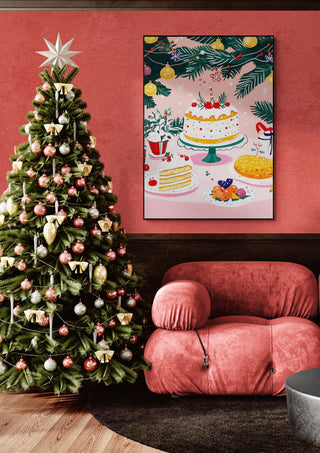 Christmas tree next to a pink armchair, with a wall art featuring festive cakes and decorations above.