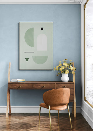 Modern room with pastel blue wall, abstract art, wooden desk, brown chair, and vase of yellow flowers.