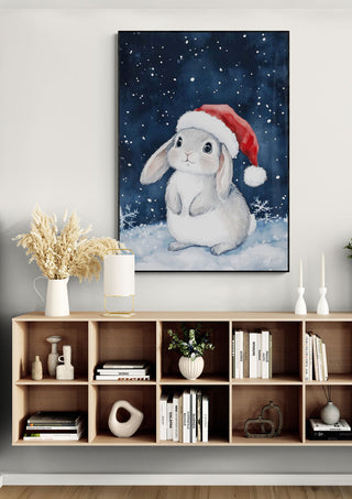 Framed artwork of a rabbit in a Santa hat, displayed above a holiday-themed living room shelf.