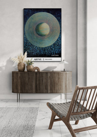 Poster of Saturn by Martin Zen hanging above a wooden console in a modern living room setting.