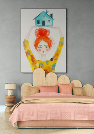 Art print "Strong as Pippi" by David Wolf hanging above a pink and wood bed in a modern bedroom.