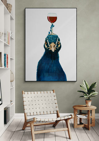 Framed art print of a peacock with a glass of wine balanced on its head, displayed in a modern living room.