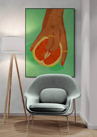Modern interior with Fruitlover by Raissa Oltmanns, featuring a hand holding half a grapefruit on a green background.
