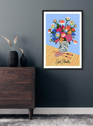 Framed Sushi Plante - Nina Broen art print featuring a bouquet of sushi-shaped flowers in a vase.