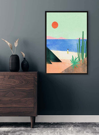 Framed "Beach Girl" by Henry Rivers hangs on a dark wall above a modern wooden dresser with vases.