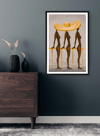 Framed "Big Yellow Hat" by Martina Karlsson displayed on a dark wall above a dresser in a modern room.