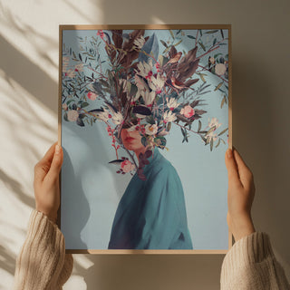 Hands holding "I Was Hidden but You Saw Me" art print by Frank Moth, featuring a person with floral collage head.