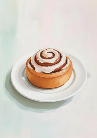 A freshly baked cinnamon roll with icing on top, served on a white plate.