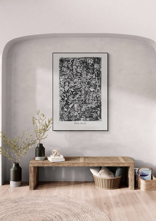 Framed Small World 1914 by Paul Klee displayed on a modern wall above a wooden bench in a minimalist room.