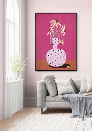 Framed "Flowers in Vase" by Raissa Oltmanns displayed above a light gray sofa in a modern living room.