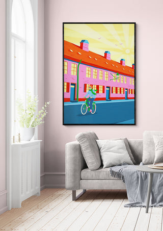 Framed "Morning Sun in Nyboder" by Nanna Paavig displayed above a modern sofa in a bright living room.