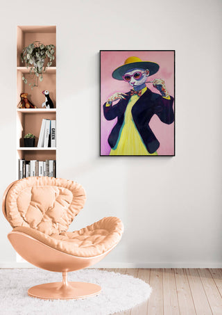 Framed Miss Cat - Martin Zen artwork on a white wall above a peach chair in a modern living room.