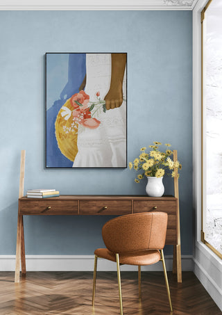 Feeling Blue - Goed Blauw artwork on a blue wall above a wooden desk with flowers and a brown chair.