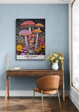 Poster of Yayoi Kusama's "Tall Shrooms" above a wooden desk with flowers in a modern room.