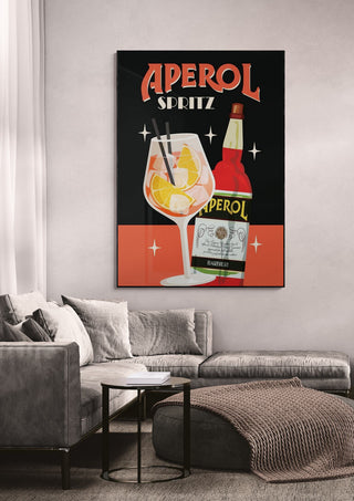 Aperol Spritz wallchart featuring a cocktail glass and Aperol bottle, displayed above a modern living room sofa.