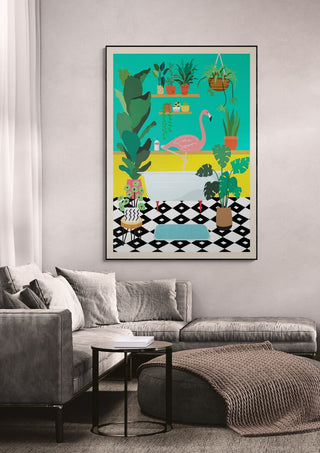 Colorful wallchart featuring a flamingo in a bathtub surrounded by plants, displayed above a modern sofa.