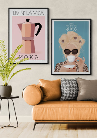 Stylish living room with a tan sofa and framed Livin La Vida Mokka coffee art by ByKammille on the wall.