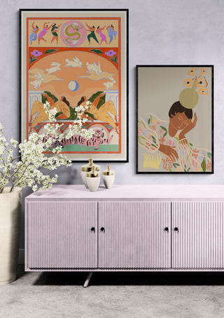Framed art print of The Overthinker by Arty Guava displayed above a pastel sideboard in a modern room.