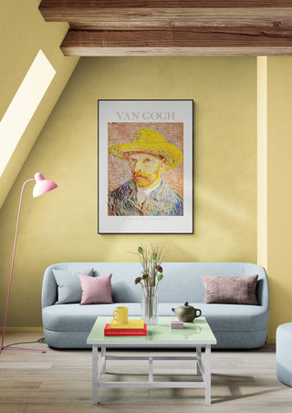 Van Gogh’s Self Portrait framed and displayed above a pastel blue sofa in a modern living room.