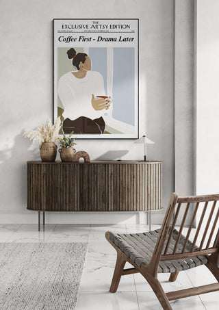 Modern living room with a Coffee First - Drama Later White Edition art print above a wooden sideboard.