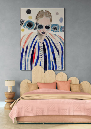 Framed "Deep Breath - Martin Zen" artwork above a modern wooden bed with soft pink bedding in a stylish bedroom.