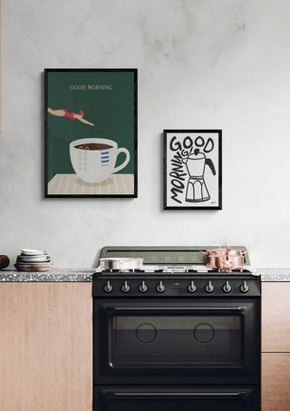 Kitchen scene with framed Good Morning! posters above a stove, featuring coffee-themed artwork.