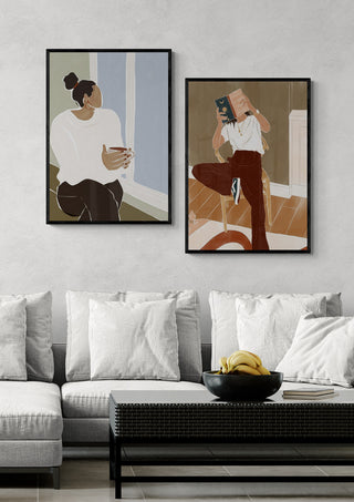 Framed art of a woman in an ivy green room, enjoying a cup of tea, displayed above a modern sofa.