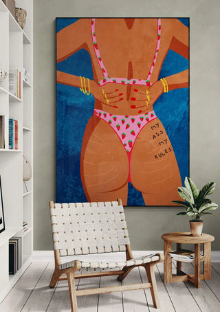 Large wall art of a woman in pink swimsuit, "My ass my rules" text on product page for Raissa Oltmanns.