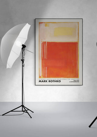 Framed Rothko Orange Perspective artwork on a wall, with studio lights positioned on either side.